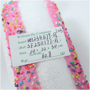 Adorno de caramelito con virutas multicolores de color rosa